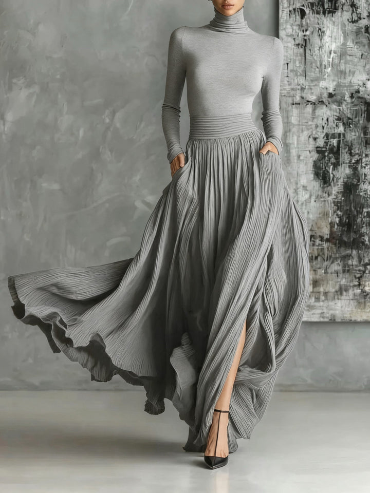 VESTIDO LARGO NEGRO PLISADO CON CUELLO ALTO KEZIAH